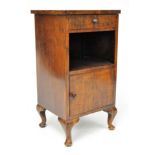 A late 19th/early 20th century mahogany bedside cabinet, raised on cabriole legs,