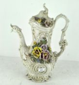 A large vintage cream-glazed Capodimonte jug with dragon spout and flowers in relief,