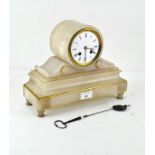 A early 20th Century alabaster mantel clock, on a plinth base with gilt details,