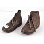 A pair of children's Tarso Pronator vintage lace-up boots, brown leather with wooden soles,