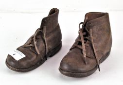 A pair of children's Tarso Pronator vintage lace-up boots, brown leather with wooden soles,