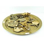 A brass charger with engraved decoration,