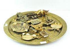 A brass charger with engraved decoration,