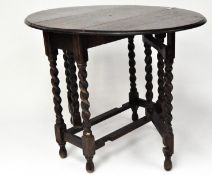 An oak barley twist gate leg table,