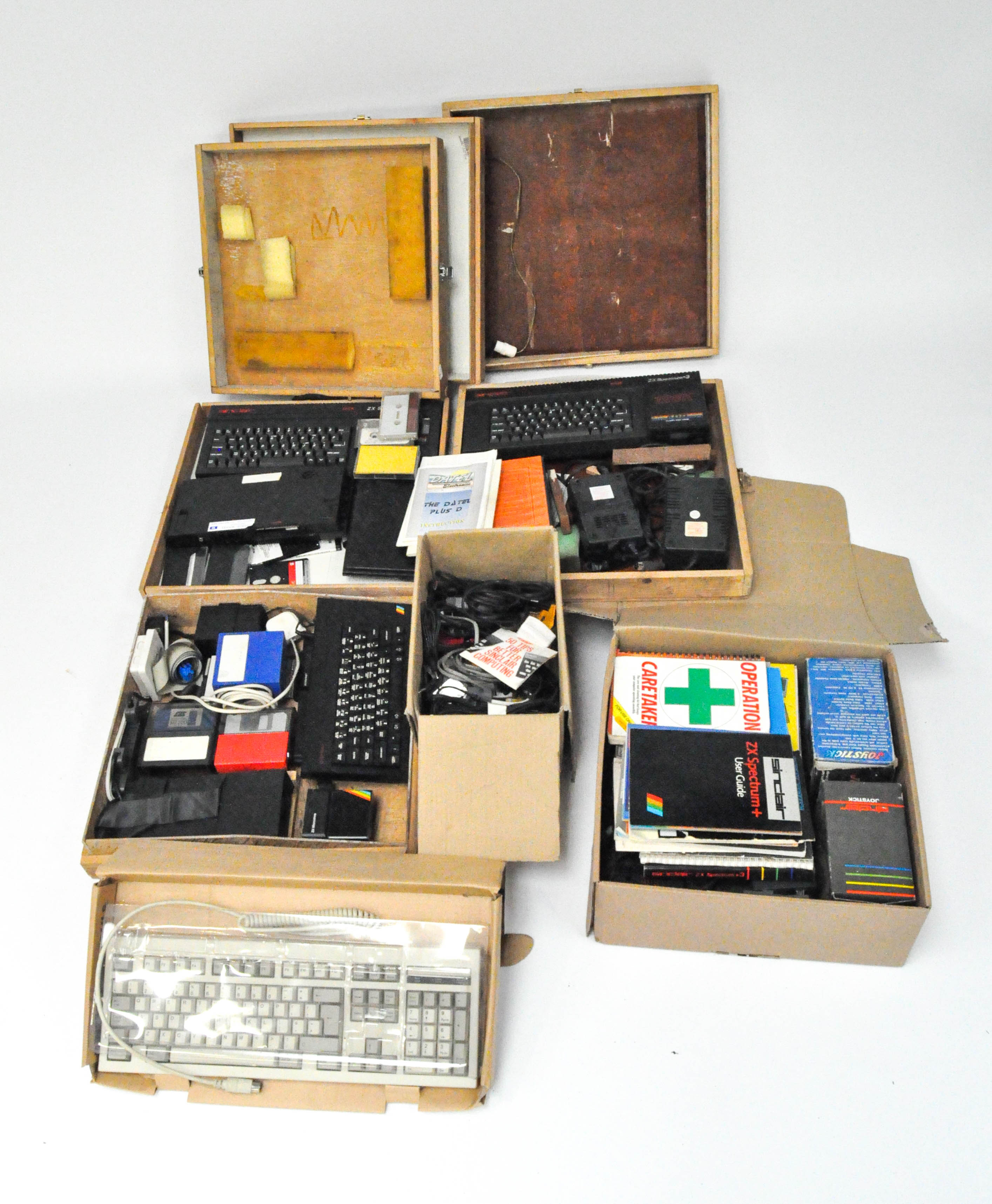A selection of vintage ZX spectrum's and related equipment, disks, books, accessories and more