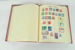 A mid century stamp album, containing a variety of stamps of assorted ages and designs,