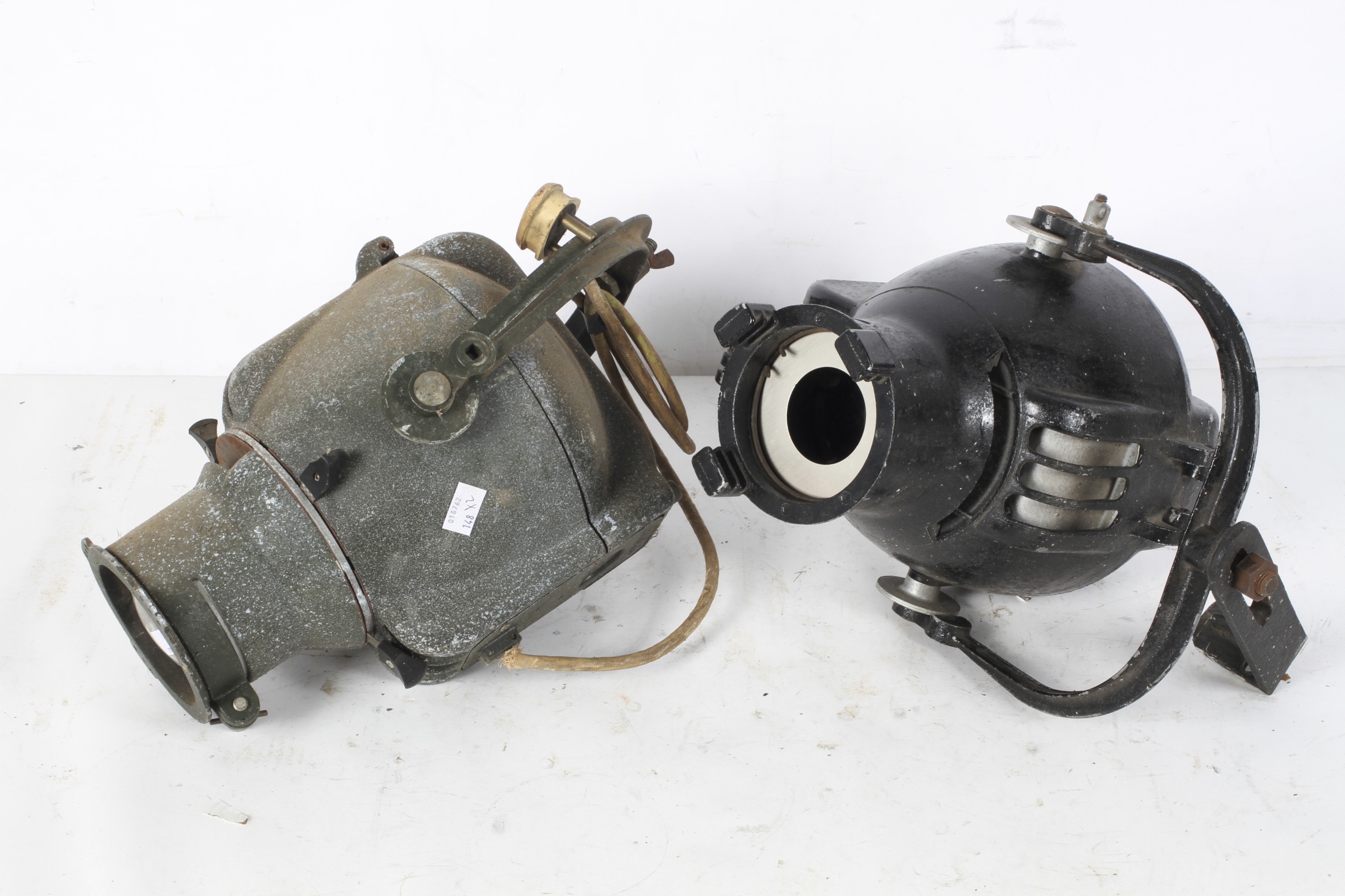 Two Strand Electric industrial lamps including one black example