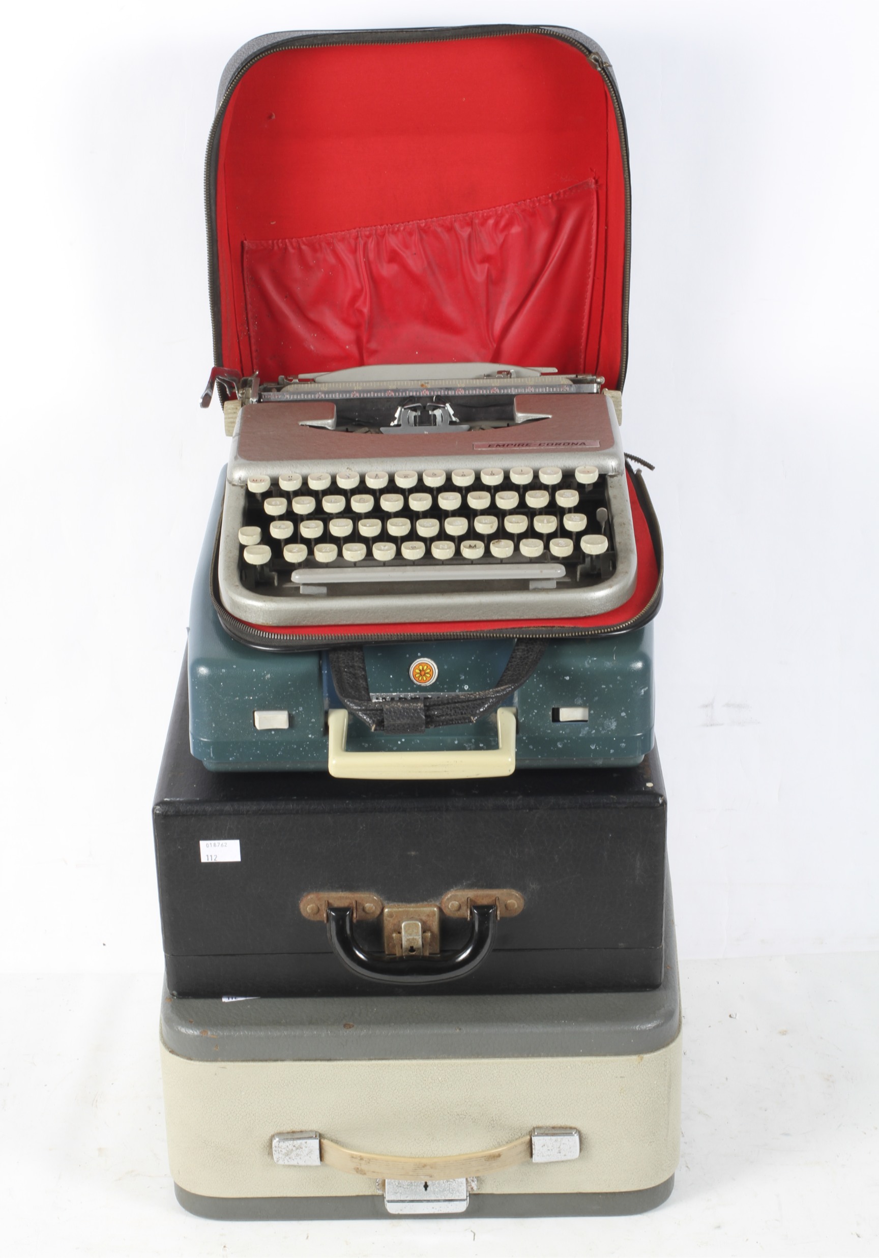 A Remington Rand typewriter, together with three others including an Olympia,