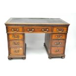 A late Victorian mahogany twin pedestal desk,