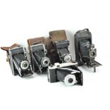 A selection of vintage cameras, comprising three Kodaks, a 'King Penguin' and more,
