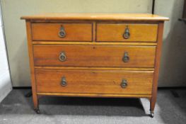 A 20th Century mahogany chest of drawers, two shorter above two longer drawers,