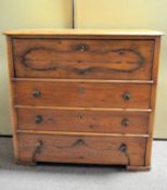 An early 20th century stained pine chest of drawers with a fall (?) behind a locked front above