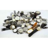 A selection of assorted watches, including vintage wristwatches, a stop watch and more