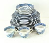 A Staffordshire part tea and dinner service in the 'Old Castle' pattern, comprising three cups,