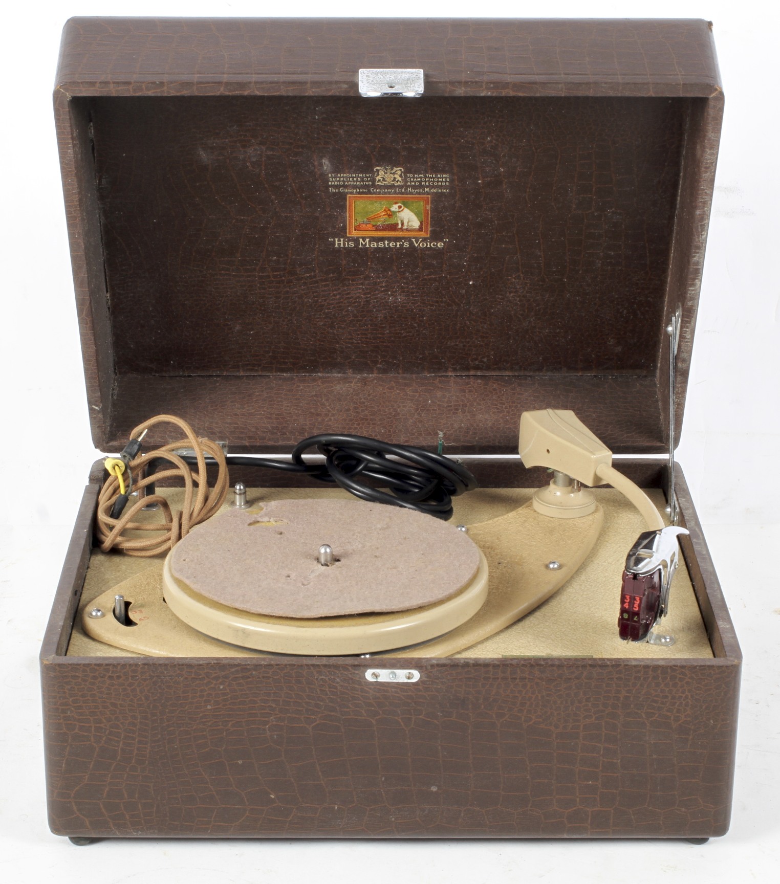 A mid-century HMV record player in simulated brown leather hinged case,