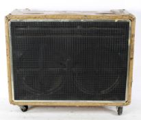 A vintage JMI amplifier, with Goodman's Power Range Audiom 12-P 12 inch speakers, on wheels,