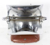 A 1930s electric fire heater with convex chrome back and single heat bar,