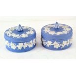 A pair of Wedgwood Jasperware blue and white pots and covers, circular in form,