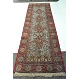 A Turkish wool rug in shades of blue, red and yellow,