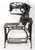 A late 19th/early 20th century cobblers Singer sewing machine on original treadle base,