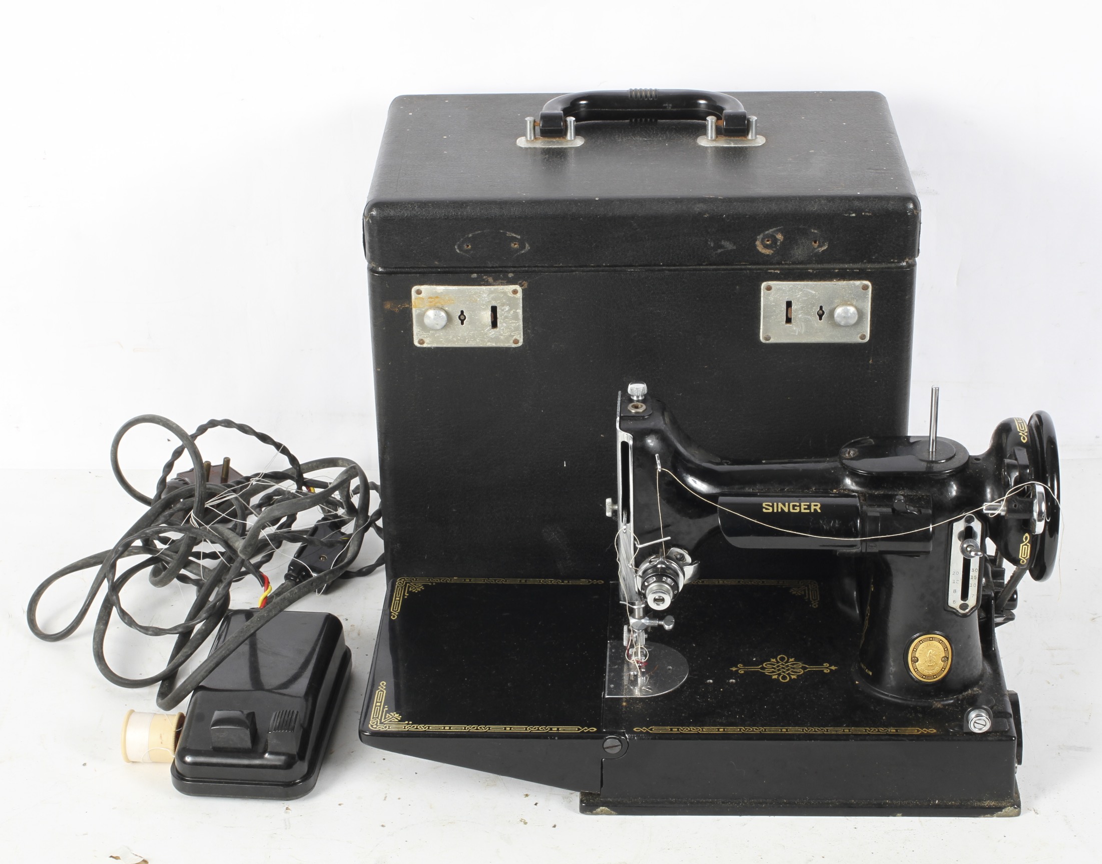 A black and gilt Singer sewing machine