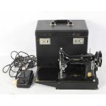 A black and gilt Singer sewing machine