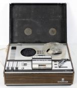 A vintage Grundig TK-146 reel to reel recorder, fitted in wood effect,