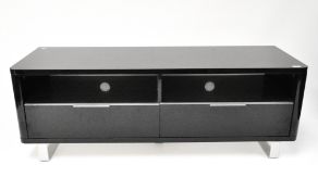 A large high gloss black Italian media unit consisiting of two shelves above drawers on runners,