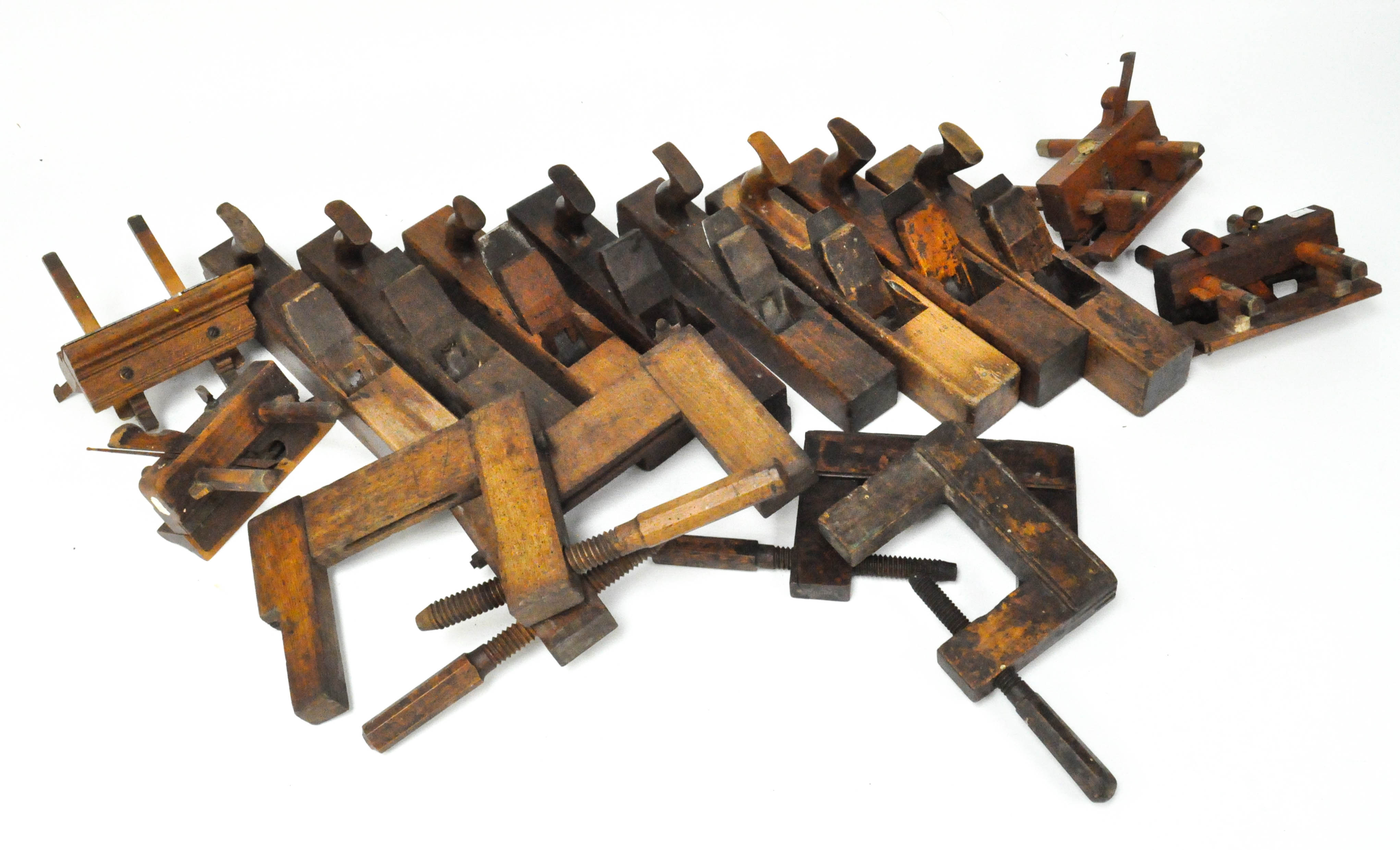 A selection of woodworking tools, comprising of eight jack planes and others,