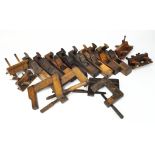 A selection of woodworking tools, comprising of eight jack planes and others,