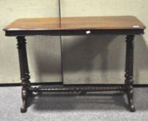 A mahogany console table with twist-carved legs and stretcher,