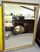 A modern mirror with a gilt frame,