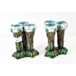A pair of majolica vases, modelled as three stalks of flowers,