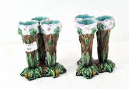 A pair of majolica vases, modelled as three stalks of flowers,