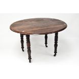 A large late 19th-early 20th Century manhogany drop leaf table, of circular shape,