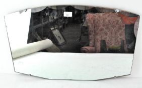 An Art Deco mirror with curved top and part bevelled edge,