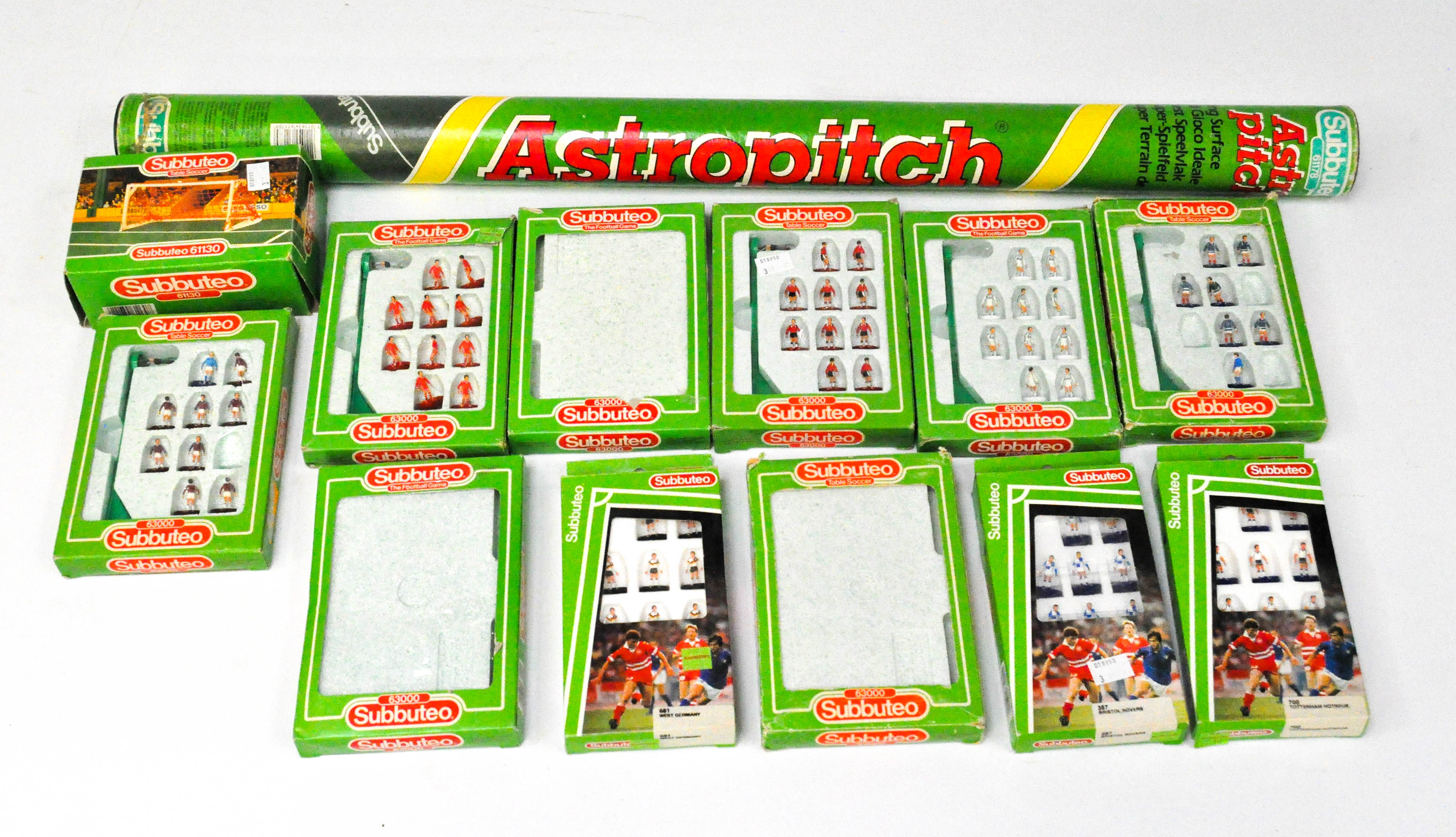An assortment of vintage Subbuteo football players and accessories, including West Ham Utd,