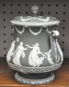 A Wedgwood dipped green, 'Dancing Hours' jasperware biscuit barrel and cover,