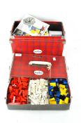 A cased set of vintage Lego, in assorted colours and shapes,
