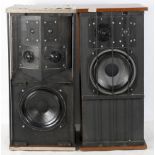 Two vintage speakers, possibly Radford, with power units to the back, within wooden cases,