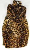 An early/mid 20th century 'leopard' fur coat, with label to inside "Packhards,