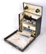 A Hinders Limited vintage portable medical kit, the fitted interior containing trays, bottles,