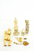 A selection of carved ivory, including standing and seated figures, a puzzle ball and more,
