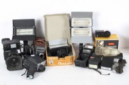 A collection of cameras/cine cameras including a Polaroid 600 SE, a Polavision Land Camera and more