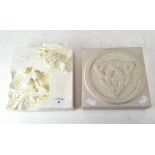A carved limestone block with an encircled symbol to the centre, 5cm x 20cm x 20cm,