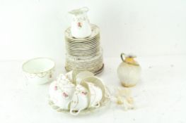 A Royal Doulton part tea service, decorated with printed pink flowers and wreaths.