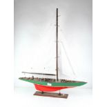 An early 20th Century wooden model of a sailing boat,