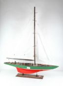 An early 20th Century wooden model of a sailing boat,