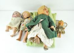 Four early to mid 20th century dolls, with bisque, ceramic and plastic heads,