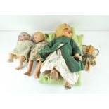 Four early to mid 20th century dolls, with bisque, ceramic and plastic heads,